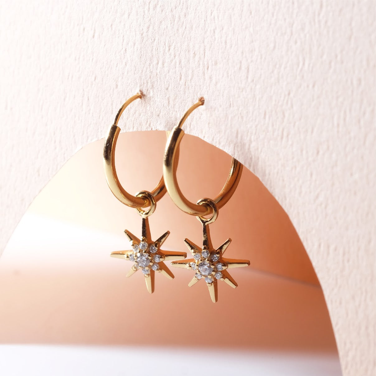 Small hoop earrings with dangling star ER011
