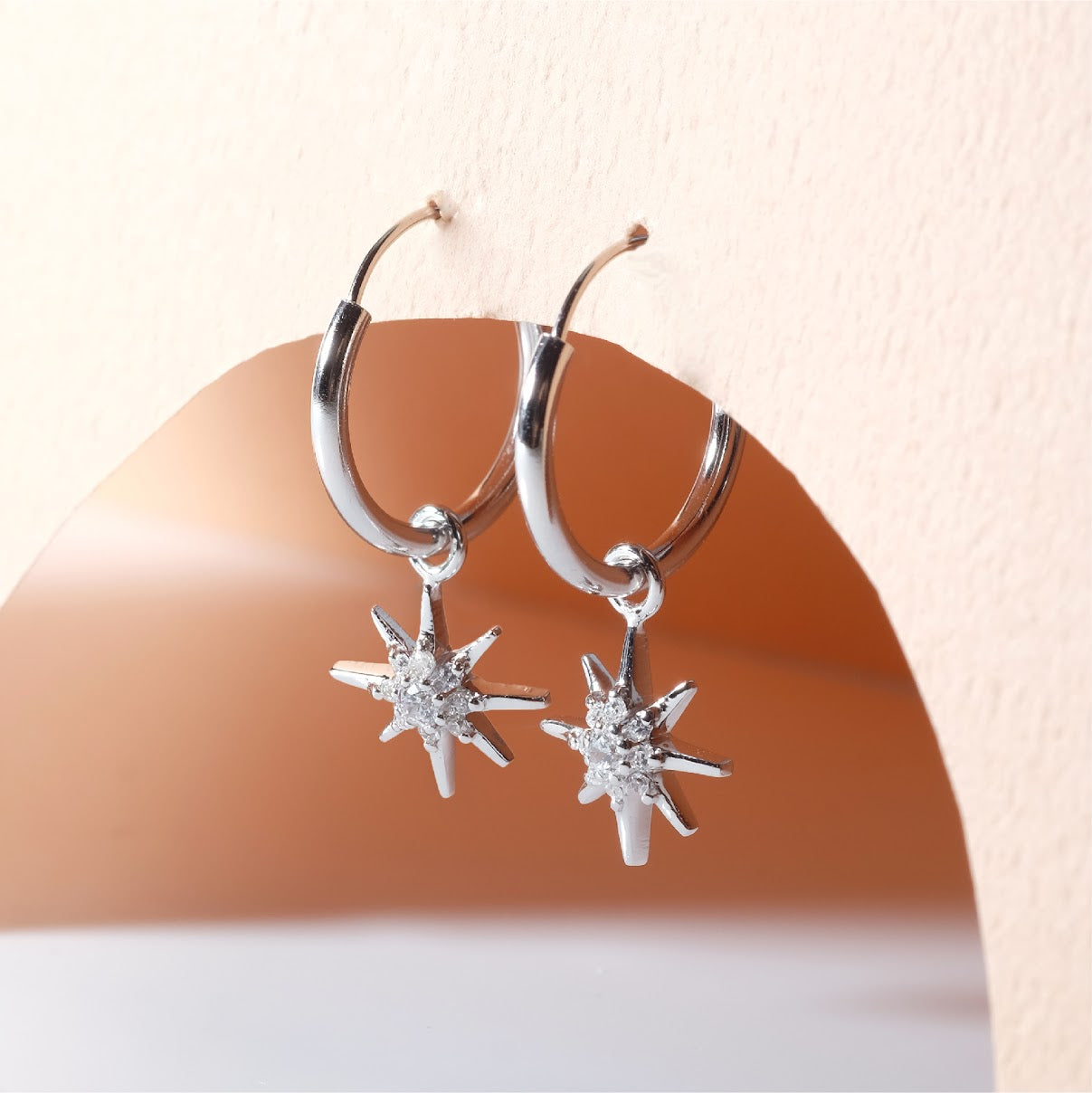 Small hoop earrings with dangling star ER011